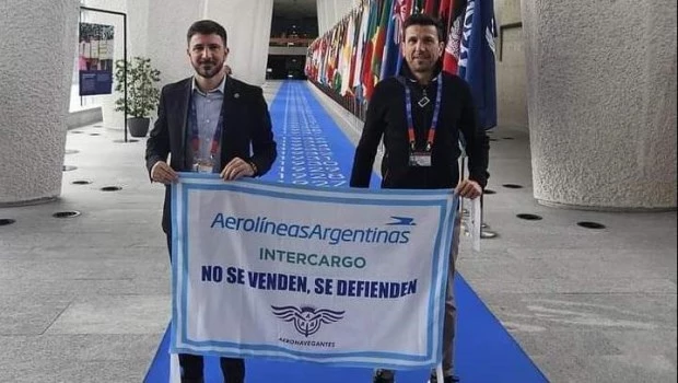 Horacio Calculli, secretario de Seguridad, y Juan Pablo Brey, titular de Aeronavegantes, en la cita de la OIT.